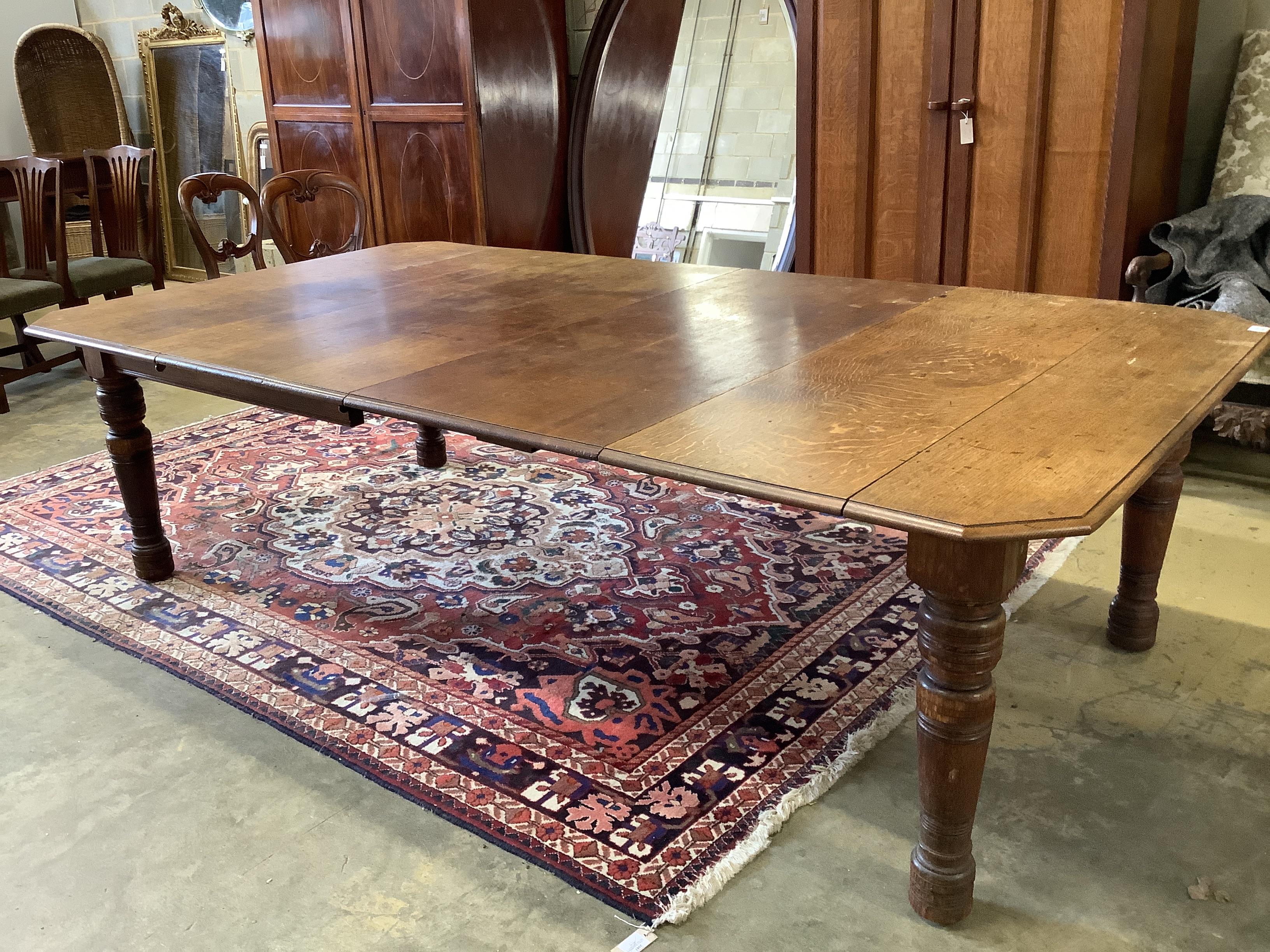 A late Victorian Aesthetic period oak extending dining table, 258cm extended, two spare leaves, width 140cm, height 73cm